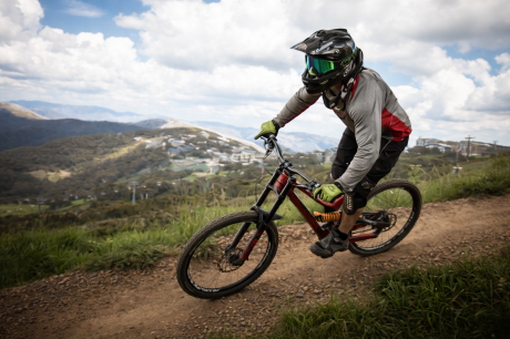 Mountain biker wearing a helmet on a trail